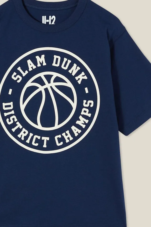 Jono Short Sleeve Print Tee In The Navyslam Dunk District Champs BoysGirls Cotton On Tops and TShirts Jono Short Sleeve Print Tee In The Navyslam Dunk District Champs BoysGirls Cotton On Tops and TShirts